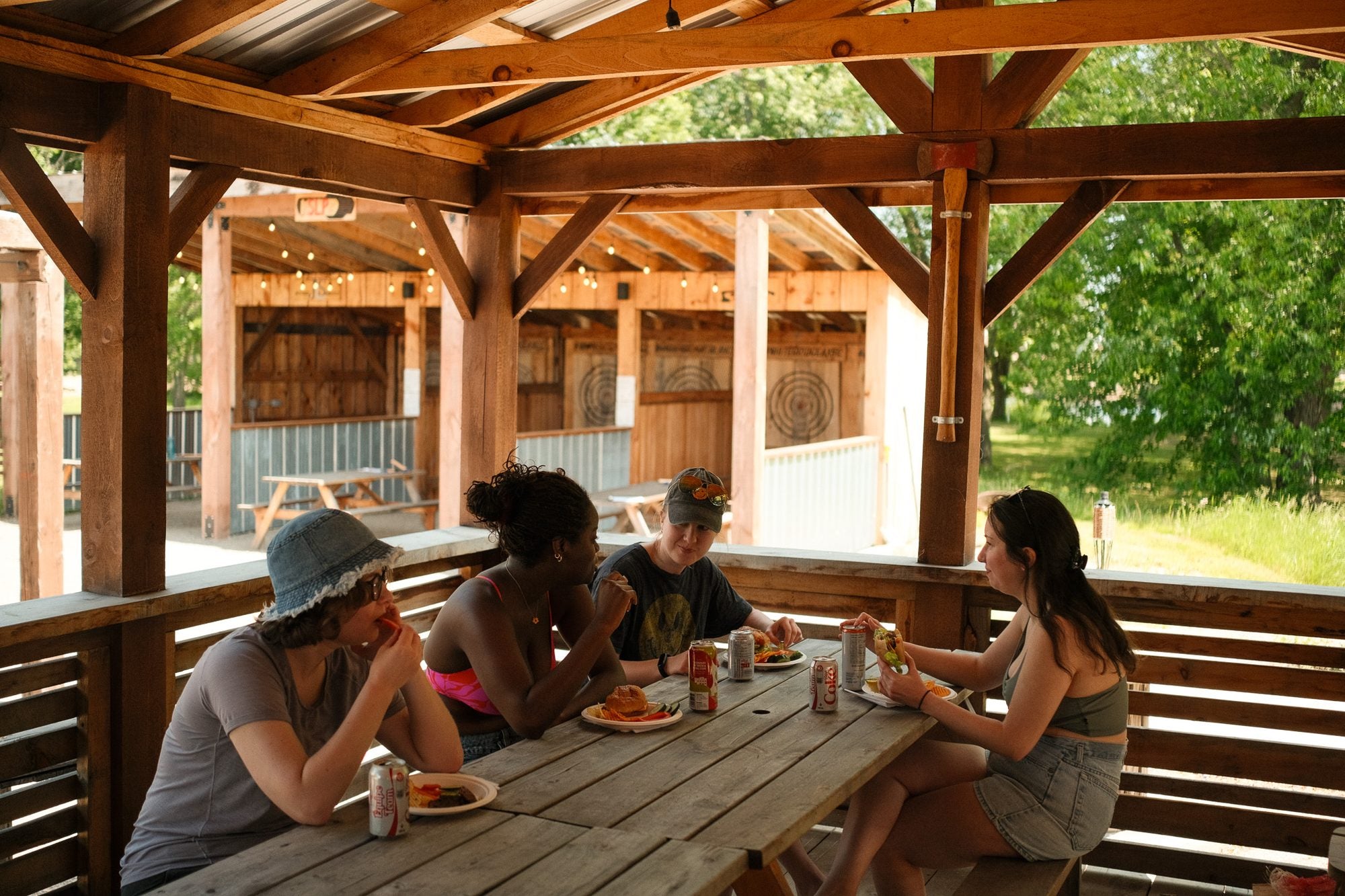 Guests eating together under the covered pavilion